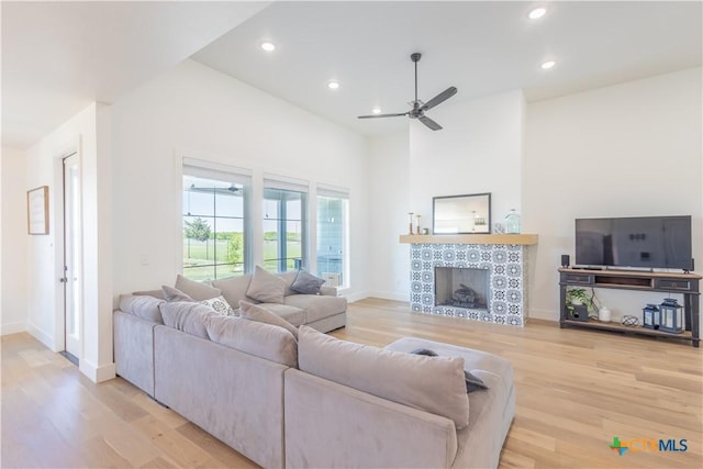 4324 Cedar Creek Rd, Temple, TX 76504 - living room featuring light wood-style flooring, a ceiling fan, baseboards, recessed lighting, and a fireplace
