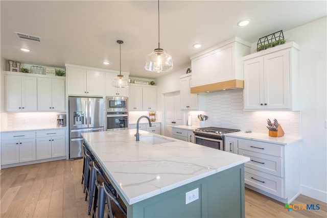4324 Cedar Creek Rd, Temple, TX 76504 - kitchen with stainless steel appliances, a sink, light wood-style flooring, recessed lighting, and backsplash