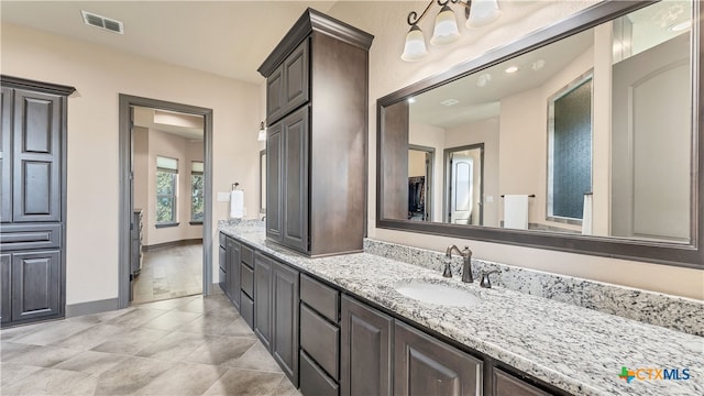 bathroom featuring vanity and tile patterned flooring