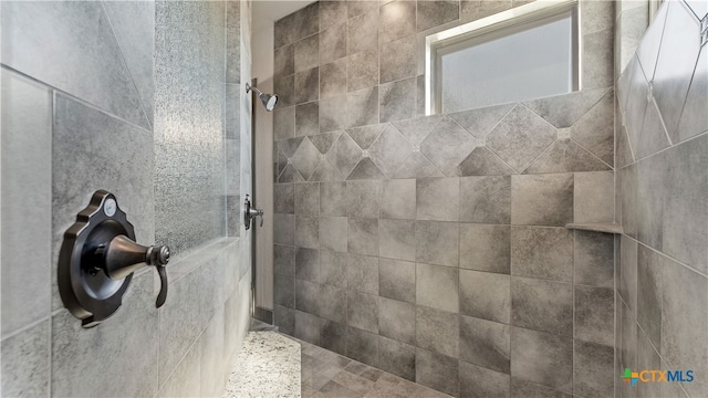 bathroom featuring tiled shower