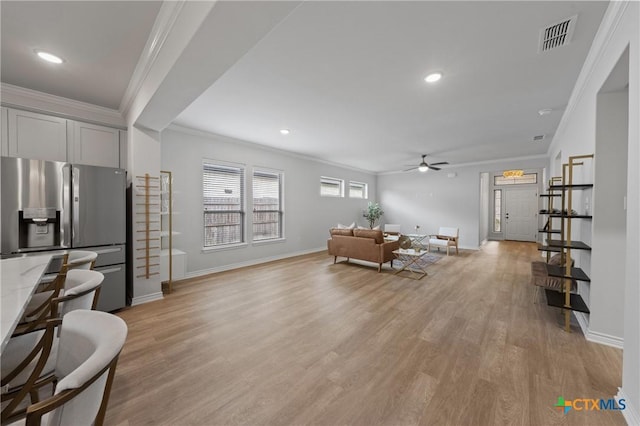 10205 Eaglefire Dr, Temple, TX 76502 - living room with ornamental molding, ceiling fan, baseboards, light wood-style flooring, and recessed lighting