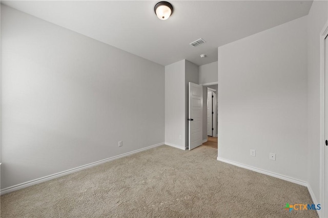 unfurnished bedroom with baseboards, visible vents, and carpet flooring