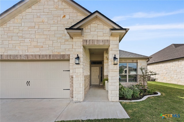 view of front of house with a shingled roof, an attached garage, stone siding, driveway, and a front lawn