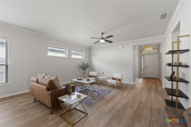 10205 Eaglefire Dr, Temple, TX 76502 - living room with wood finished floors, crown molding, a ceiling fan, and baseboards
