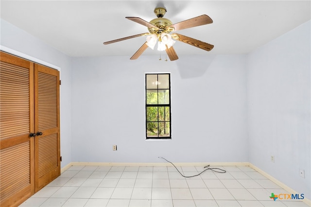 unfurnished bedroom with a closet and ceiling fan