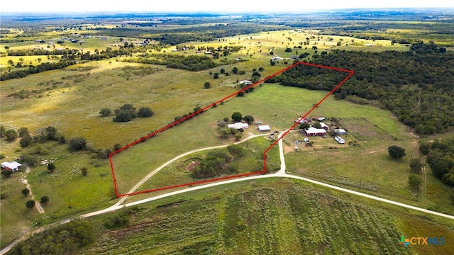 birds eye view of property featuring a rural view