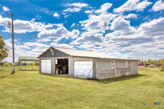 garage with a lawn