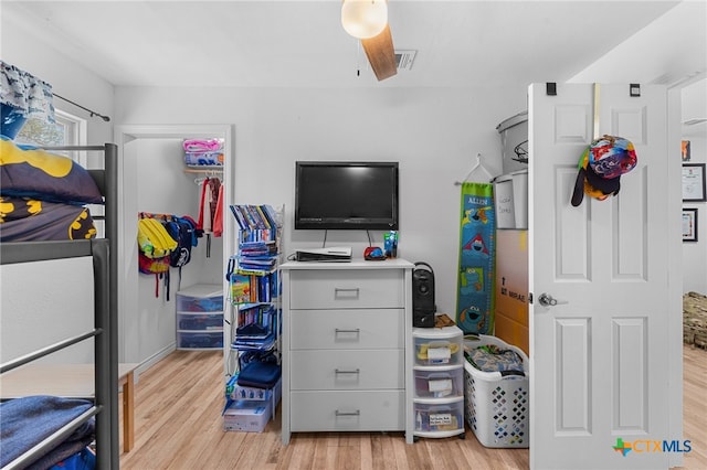 bedroom featuring light wood-type flooring and ceiling fan