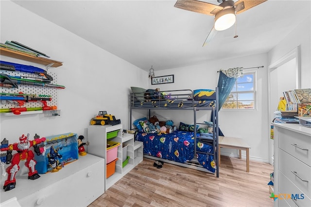 bedroom featuring light hardwood / wood-style floors and ceiling fan