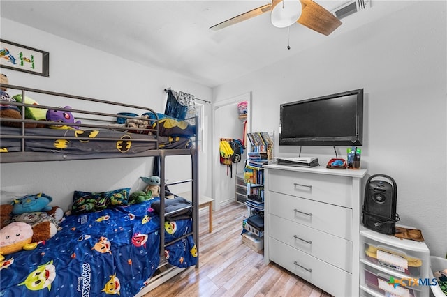 bedroom with light wood-type flooring and ceiling fan