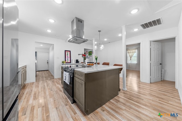 kitchen with light hardwood / wood-style flooring, ventilation hood, an island with sink, and electric range oven