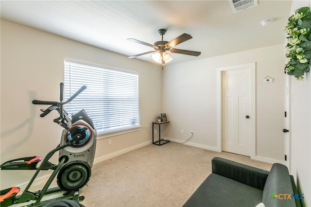 exercise room with ceiling fan, carpet, visible vents, and baseboards