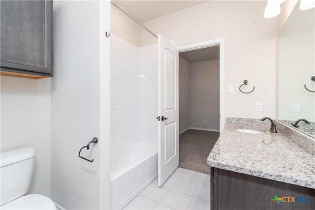 full bathroom featuring toilet, tile patterned flooring, vanity, and washtub / shower combination