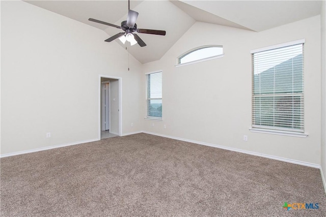 spare room with high vaulted ceiling, carpet flooring, and ceiling fan