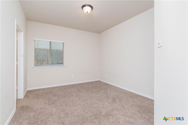 unfurnished room with light colored carpet