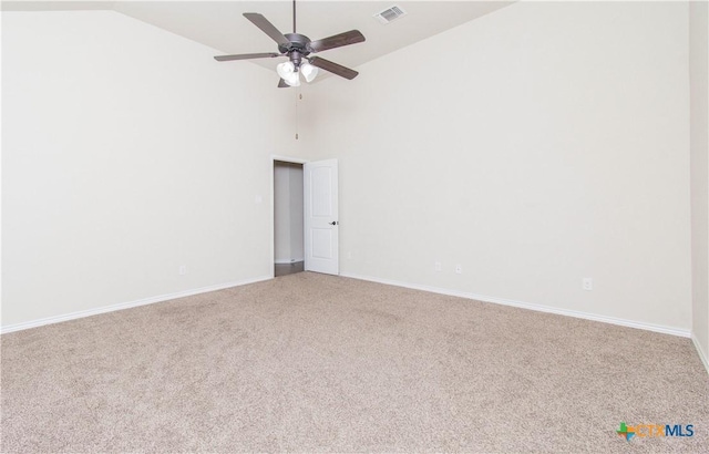 unfurnished room featuring high vaulted ceiling, carpet flooring, and ceiling fan