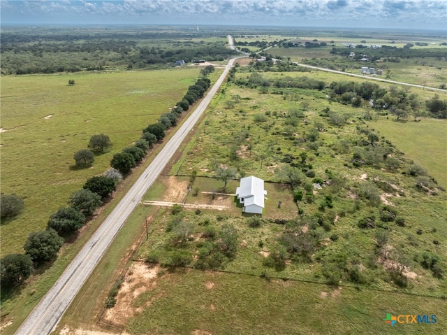 birds eye view of property featuring a rural view