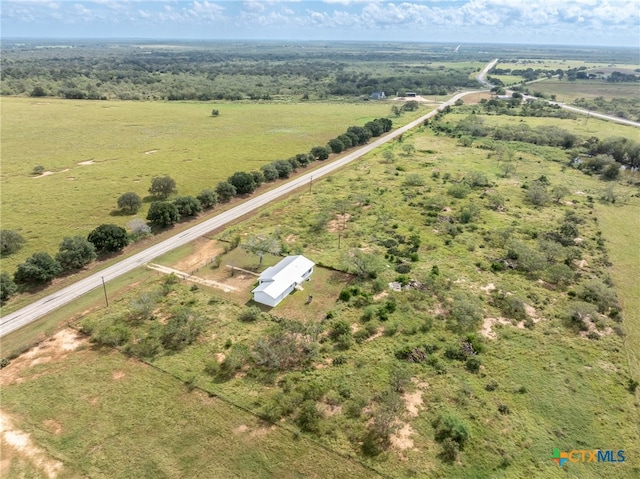 birds eye view of property featuring a rural view