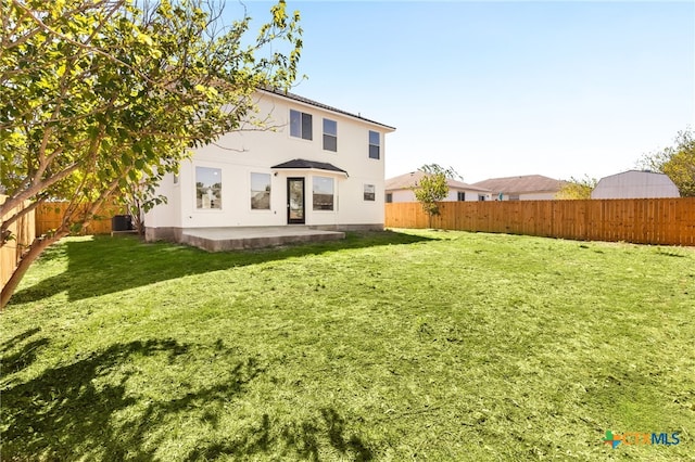 208 Langely, Kyle, TX 78640 - rear view of house featuring a fenced backyard and a patio area