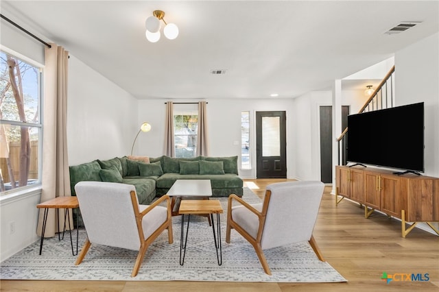 208 Langely, Kyle, TX 78640 - living room featuring light wood finished floors and healthy amount of natural light