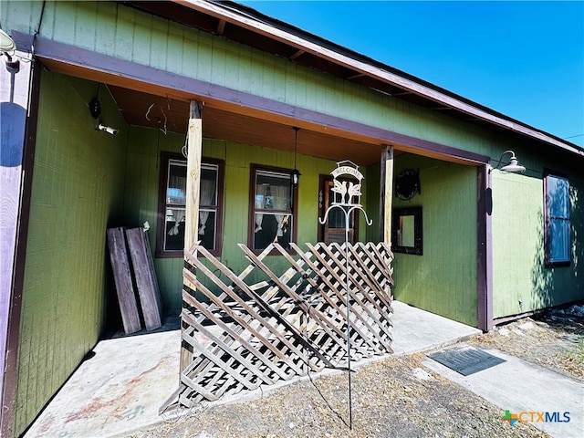 doorway to property featuring a porch