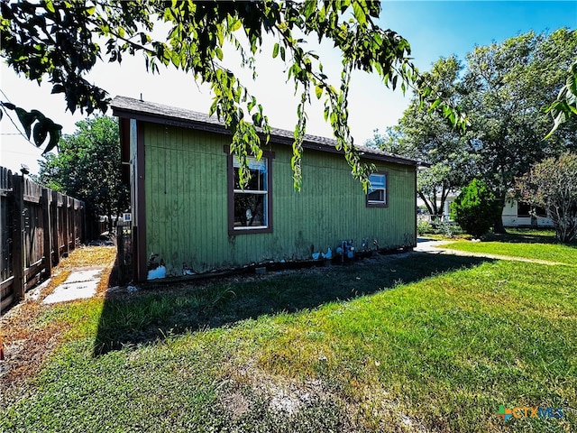 view of home's exterior with a lawn