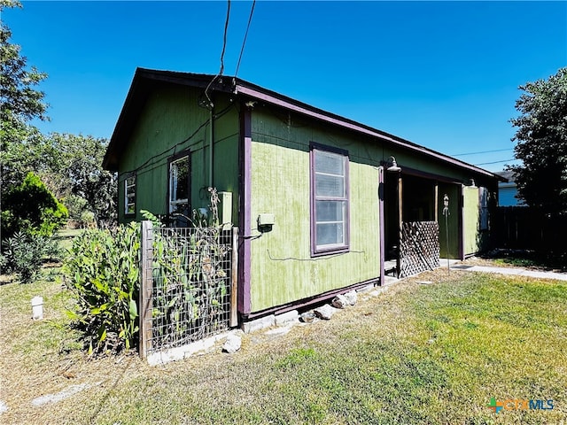 view of property exterior featuring a yard