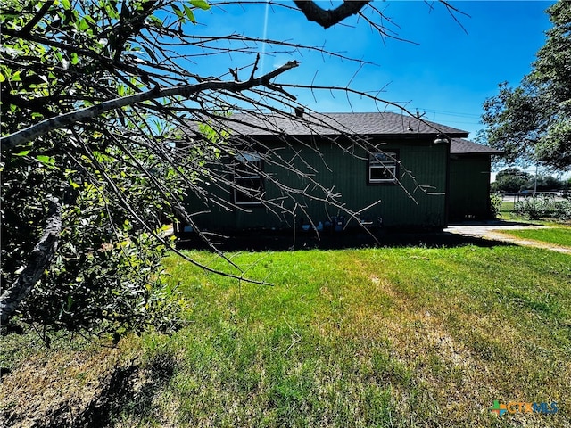 view of home's exterior with a yard