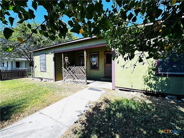 bungalow-style house with a front lawn