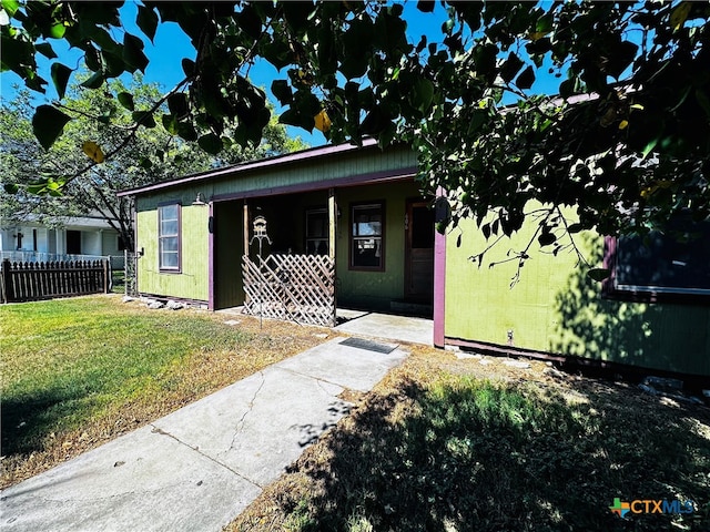 exterior space featuring a front lawn