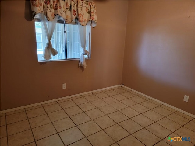 view of tiled spare room