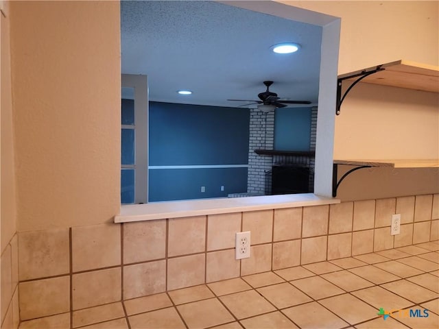 interior space featuring ceiling fan