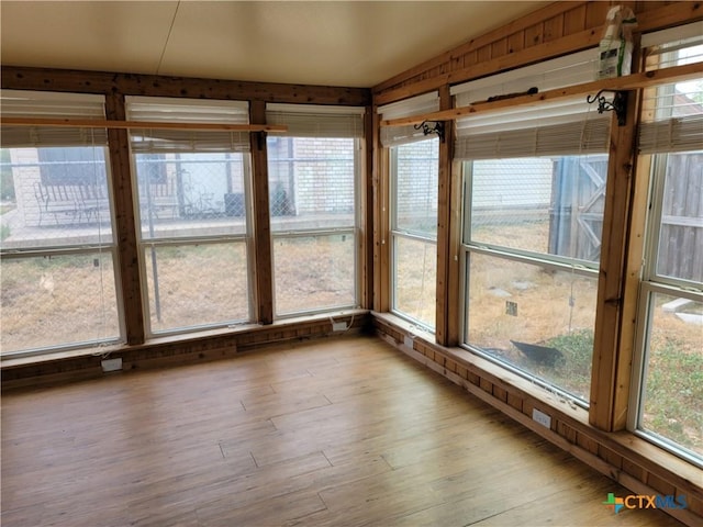 unfurnished sunroom featuring a wealth of natural light