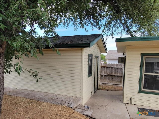 view of property exterior with a patio area