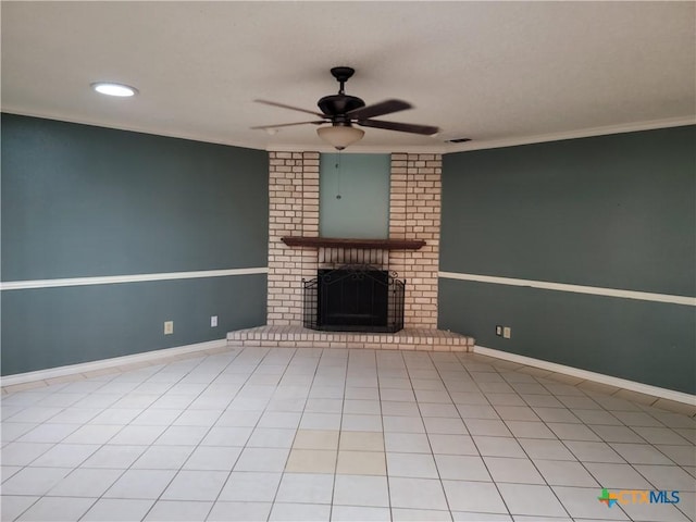 unfurnished living room featuring tile patterned floors, ceiling fan, and a brick fireplace