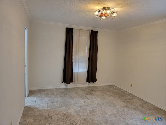 empty room with a textured ceiling and ornamental molding