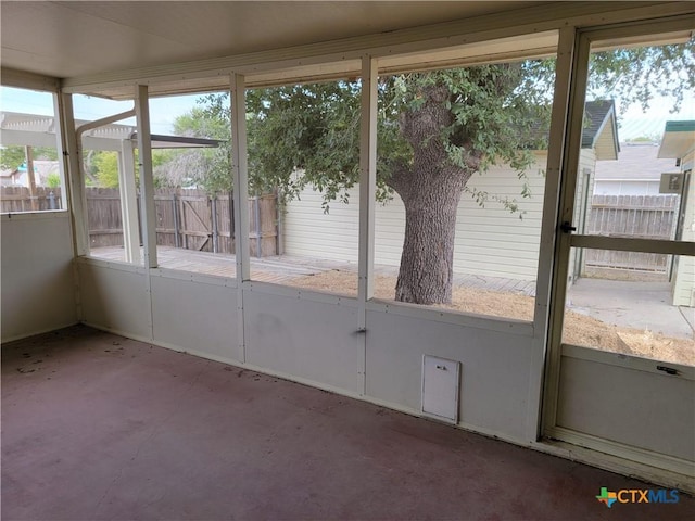 unfurnished sunroom featuring a wealth of natural light