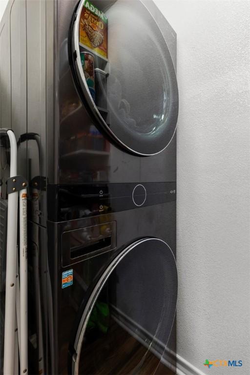 1301 Chapel Creek Rd, Waco, TX 76712 - washroom featuring stacked washer / drying machine