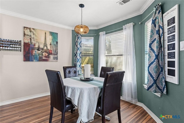 1301 Chapel Creek Rd, Waco, TX 76712 - dining room with baseboards, wood finished floors, and crown molding