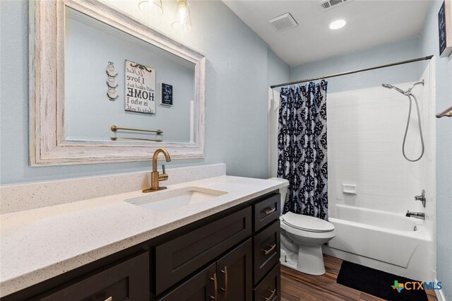 1301 Chapel Creek Rd, Waco, TX 76712 - bathroom with vanity, toilet, shower / bath combo with shower curtain, and wood finished floors