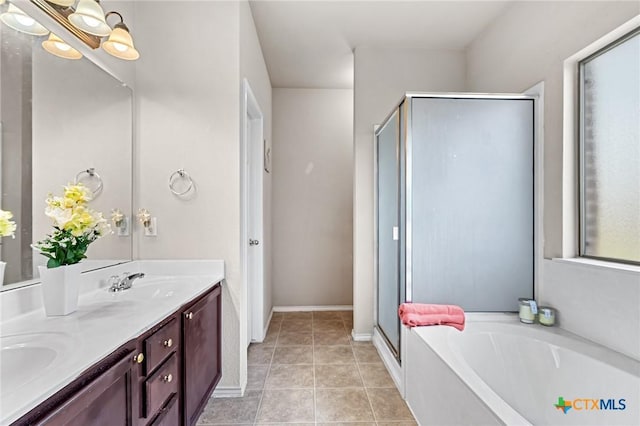 6804 Bayberry Dr, Killeen, TX 76542 - full bathroom with a stall shower, a garden tub, double vanity, and tile patterned floors