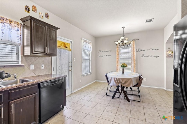 6804 Bayberry Dr, Killeen, TX 76542 - kitchen with black dishwasher, dark brown cabinetry, a chandelier, tasteful backsplash, and light tile patterned floors
