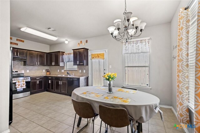6804 Bayberry Dr, Killeen, TX 76542 - dining space featuring light tile patterned flooring and a chandelier