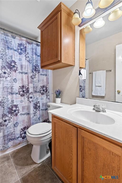 6804 Bayberry Dr, Killeen, TX 76542 - bathroom with vanity, tile patterned flooring, and a shower with curtain