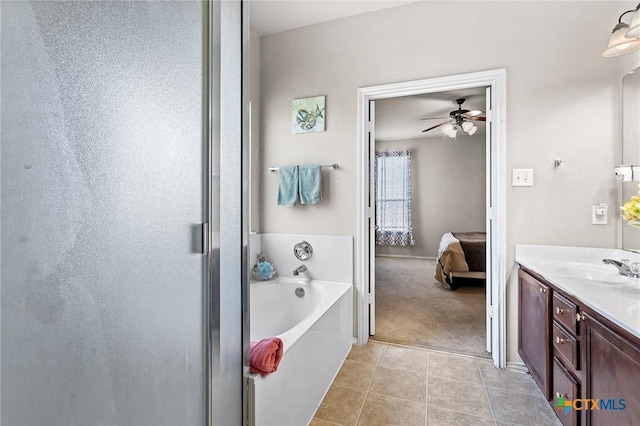 6804 Bayberry Dr, Killeen, TX 76542 - full bath with ensuite bath, vanity, a bath, tile patterned flooring, and ceiling fan