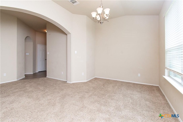 7010 Cokui Dr, Killeen, TX 76542 - carpeted empty room with arched walkways, a chandelier, and lofted ceiling