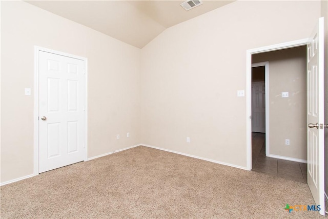 7010 Cokui Dr, Killeen, TX 76542 - carpeted empty room with vaulted ceiling and baseboards
