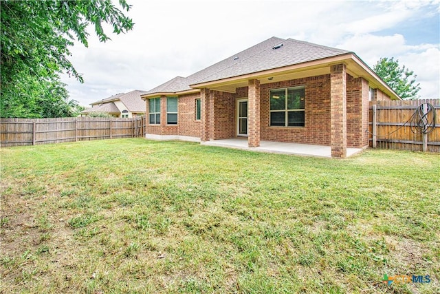 7010 Cokui Dr, Killeen, TX 76542 - rear view of property with a patio area, a fenced backyard, and brick siding