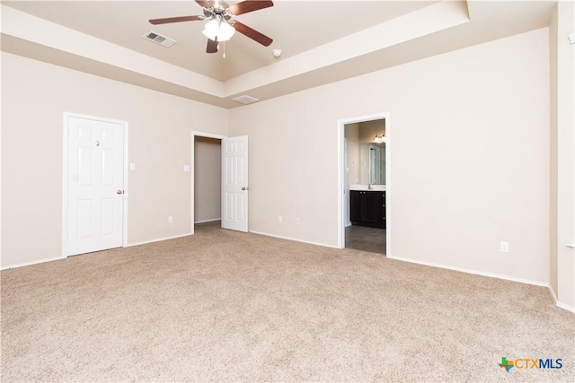 7010 Cokui Dr, Killeen, TX 76542 - carpeted spare room with a tray ceiling, a ceiling fan, and a smoke detector