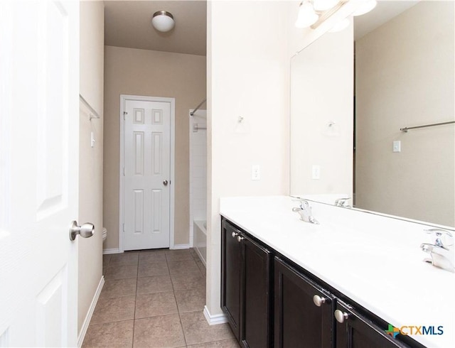 7010 Cokui Dr, Killeen, TX 76542 - bathroom featuring double vanity, tile patterned floors, and shower / washtub combination